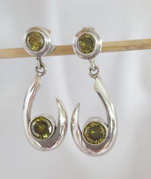 One only, exclusive silver peridot earrings