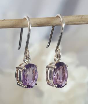 Claw set sterling silver amethyst earrings