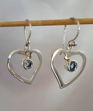 Silver hearts with blue topaz stone