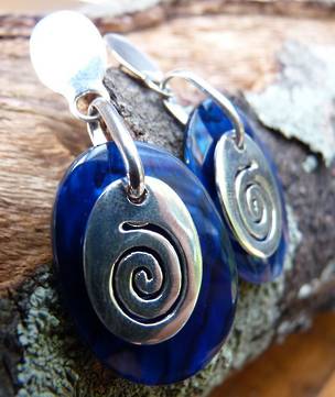 Nz paua shell earrings with koru design