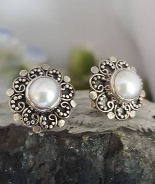 White pearl stud earrings with filigree silver frames