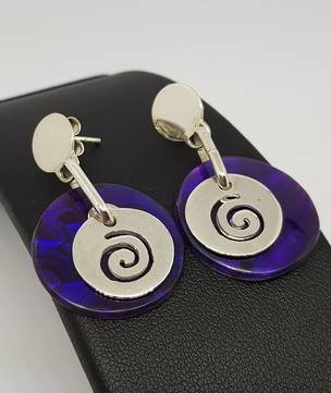 Purple paua shell earrings with koru detail