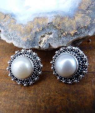 Large white pearl stud earrings with filigree silver frames