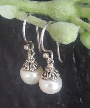 Classic pearl drop earrings with silver detail