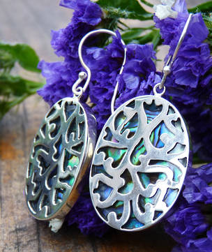 Paua shell silver earrings - ornate carved front