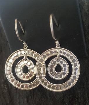 Spiral hoop earrings with dotted pattern