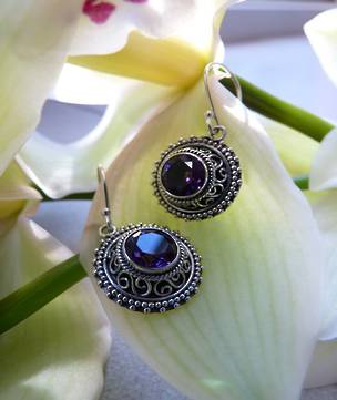 Silver earrings with purple stone