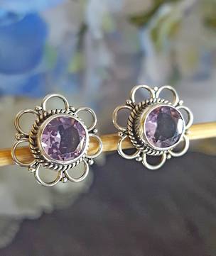 Sterling silver flower stud earrings with purple stone