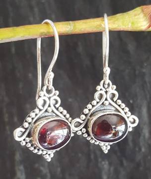 Sterling silver garnet earrings in decorative frame