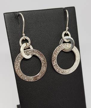 Silver hoop earrings with hammered detail