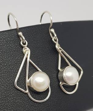 Silver pearl earrings with open silver frame