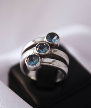 Three Stone Blue Topaz Spiral Ring