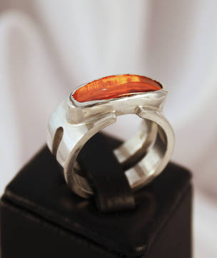 Wide band silver ring with orange stone