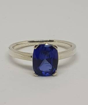 Cute little silver ring with synthetic sapphire