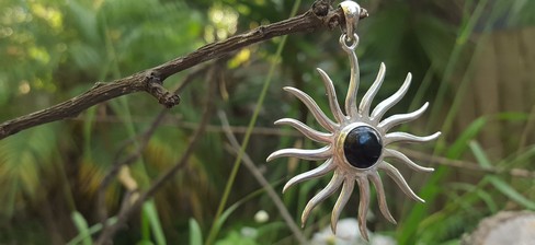 Large silver sun pendant with onyx gemstone